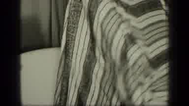 New York (1957): A Child Is Playing By Himself Underneath A Blanket