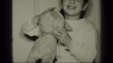 New York (1957): Girl Wearing White Shirt Holds Tan Stuffed Animal