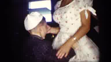 New York (1957): Boy Wearing Black Jacket Dances With Woman Wearing Pink And White