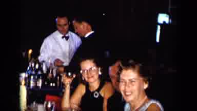 New York (1957): People Sitting Talking And Drinking At Tables At Evening