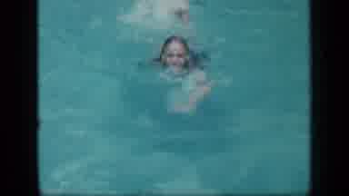 New York (1957): A Girl Is Swimming Towards The Camera Through The Water