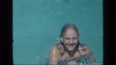 New York (1957): Boy Wearing Blue Swimwear Prepares To Jump In Pool On A Bright