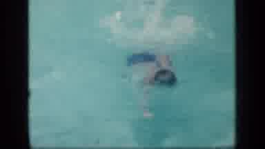 New York (1957): Kid Swimming As Best As He Can Towards Person Holding The Camera