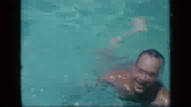 New York (1957): Man Swims In A Pool Then Takes A Short Breath Followed With Woman