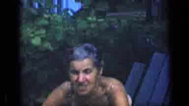 New York (1957): Elderly Woman Sitting On A Chair In A Garden Blowing A Kiss And