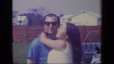 New Jersey (1970): Woman Carrying Something Then Woman Kisses Man Then Woman Is At