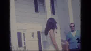 New Jersey (1970): Man And Woman Stand And Chat In Front Of The House Then Camera