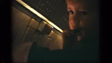 New Jersey (1970): Small Boy Gnaws On Brown Object Inside Of Dimly Lit Airplane