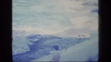 Puerto Rico (1970): Person Puts On White Shirt While Looking At Ocean Surf From