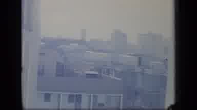 Puerto Rico (1970): Hazy Video Of Apartment Buildings In A City From A Window Up
