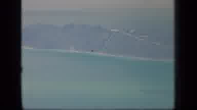 PUERTO RICO-1970: Aerial View of Lush Island Surrounded by Turquoise Water and Sand