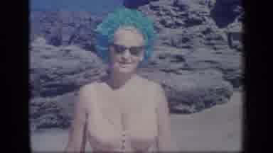 Puerto Rico (1970): Smiling Woman In An Ornate Hat Walking Towards The Camera On