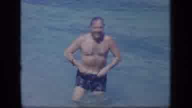 Puerto Rico (1970): Color Footage Of A Man Wading In Shallows Wearing Blue Shorts
