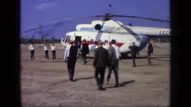 Moscow Russia (1971): Men Wearing Grey Suits Walk Towards Red And White Helicopter