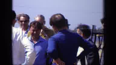 Moscow Russia (1971): Men Wearing Blue Shirts Shake Hands On A Sunny Day