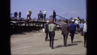 Moscow Russia (1971): Men In Business Attire And Hard Hats Climb Steps To Enter An
