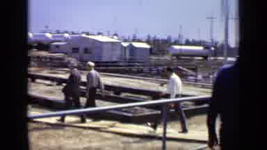 Moscow Russia (1971): Men Walking On An Unfinished Construction Site And Houses In