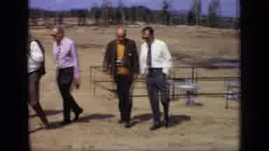 Moscow Russia (1971): Five Men Wearing Business Attire Two Holding Camera; Walk In