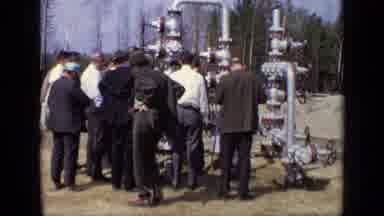 Moscow Russia (1971): Old Footage Of A Group Of Men Inspecting A Piping Structure
