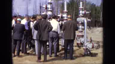 Moscow Russia (1971): Men Gathering Around A New Piece Of Technology To Discover