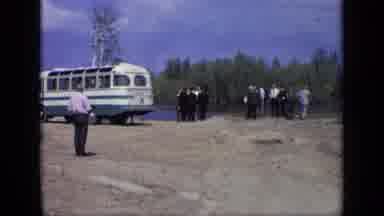 Moscow Russia (1971): A Large Group Of People Exit A Bus Into A Dirt Yard Next To