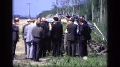 Moscow Russia (1971): A Group Of Men Gather Near The Bank Of The River While A