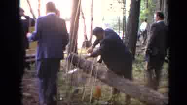 Moscow Russia (1971): Men Wearing Suits Trying To Start A Fire In A Forest