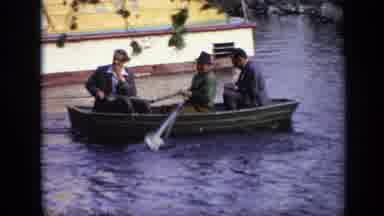 Moscow Russia (1971): Three Men In A Small Boat One Rowing It Others Sitting