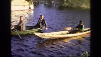 Moscow Russia (1971): Four Young Men In Suits In Boat Are Helped Or Help Another