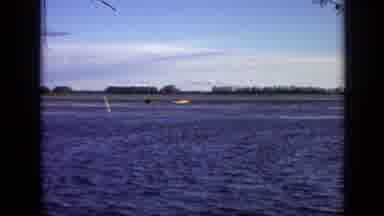 Moscow Russia (1971): Four Men In A Row Boat On A River Accompanied By Another Man