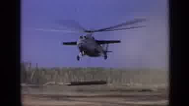 Moscow Russia (1971): Very Large Helicopter Lifting A Load Near A Large Groups Of