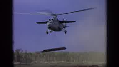Moscow Russia (1971): A Helicopter Sling Loads A Stack Of Materials Over A Dirt