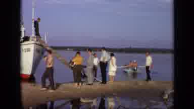Moscow Russia (1971): A Man With No Shirt On Walking Past A Group Of People