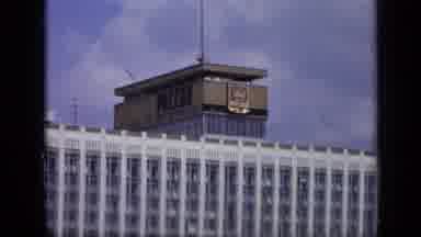 Moscow Russia (1971): View Of Red And Grey Bus And White Building On A Clear Sunny