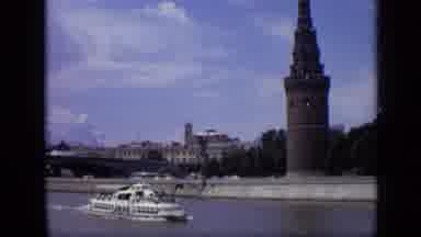 Moscow Russia (1971): Yacht Is Driven On A River Beside A City With A Large