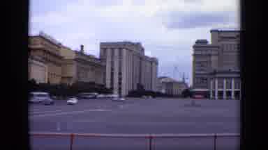 Moscow Russia (1971): People Drive Cars Down The Road In The Middle Of The City
