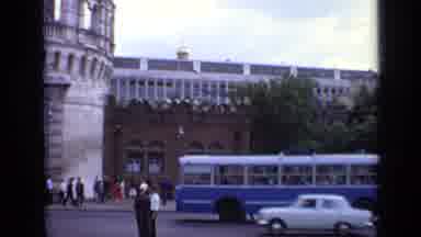Moscow Russia (1971): Vintage Busses And Cars Drive Past Buildings With Columns