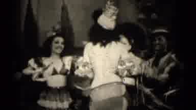 Illinois USA (1947): A Group Of Women Dance As They Wear Grass Skirts And Halter