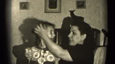 Illinois USA (1947): Mother Smoothing Back Daughter's Hair In A Loving Manner And