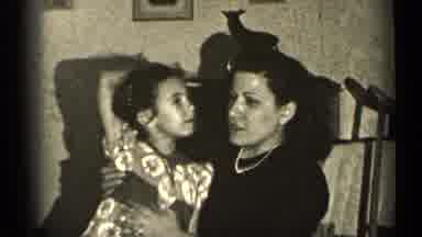 Illinois USA (1947): Mom Sitting With Daughter On Her Lap Talking With Each Other