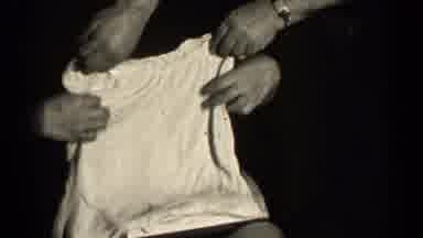 Illinois USA (1947): A Middle-Aged Woman Is Analyzing An Intimate Outfit That