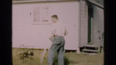 Illinois USA (1947): Man Outside Watering Grass