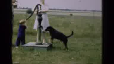 Illinois USA (1947): Funny Dog Running Around The Home The Happy Mom And Kid