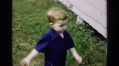 Illinois USA (1947): Little Red Haired Boy In A Blue Shirt Walking Around Outside