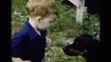 Illinois USA (1947): Little Boy Is Startled By Dog Then Follows Man Out Towards