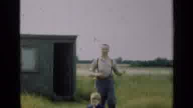Illinois USA (1947): Two Women Talking Then Father With Hands Out With Son Then