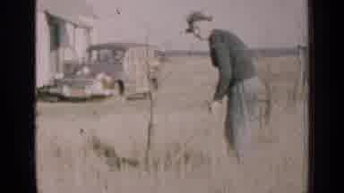 Illinois USA (1947): A Man Outside In A Field Harvesting For The Fall During The