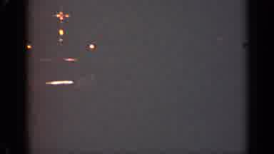 Illinois USA (1947): Person Passes By Illuminated Object In Dimly Lit Room During