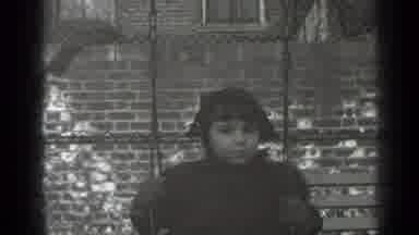 New York (1947): Black And White Film Of A Small Child On A Swing In A Playground