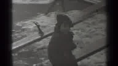 New York (1947): Small Child Sitting On A See Saw In A Park Wearing A Coat On A